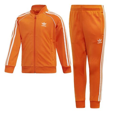 weiss orangener sportanzug von adidas von chris brown|Grun .